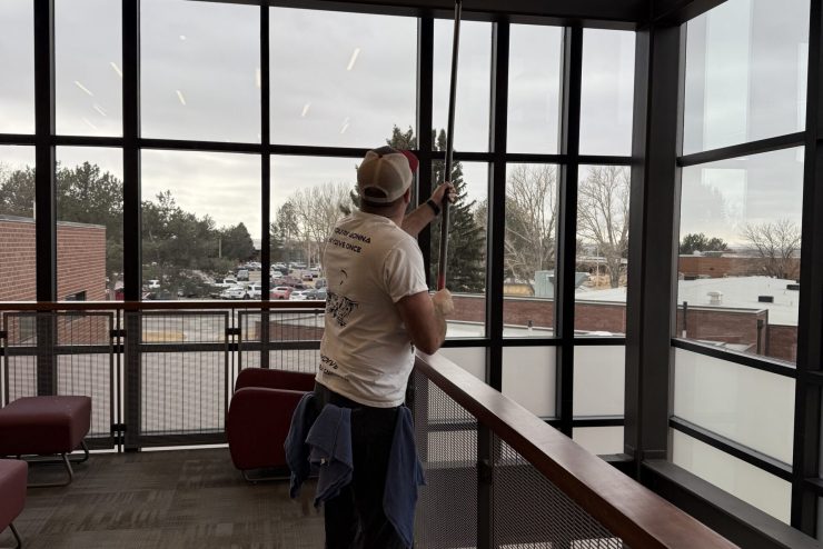 Joe cleaning commercial windows